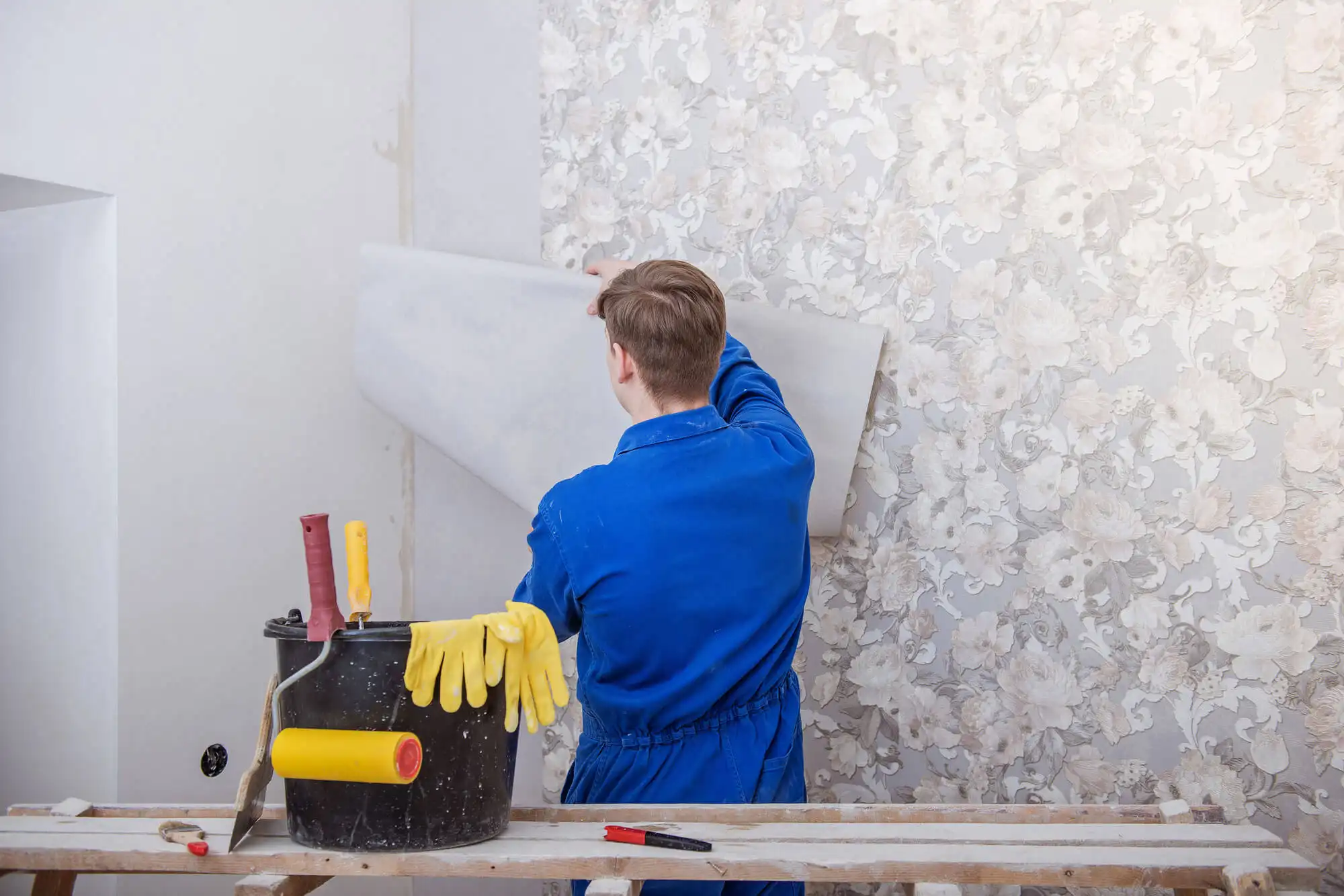 Professional wallpaper installer at work in Atlanta home